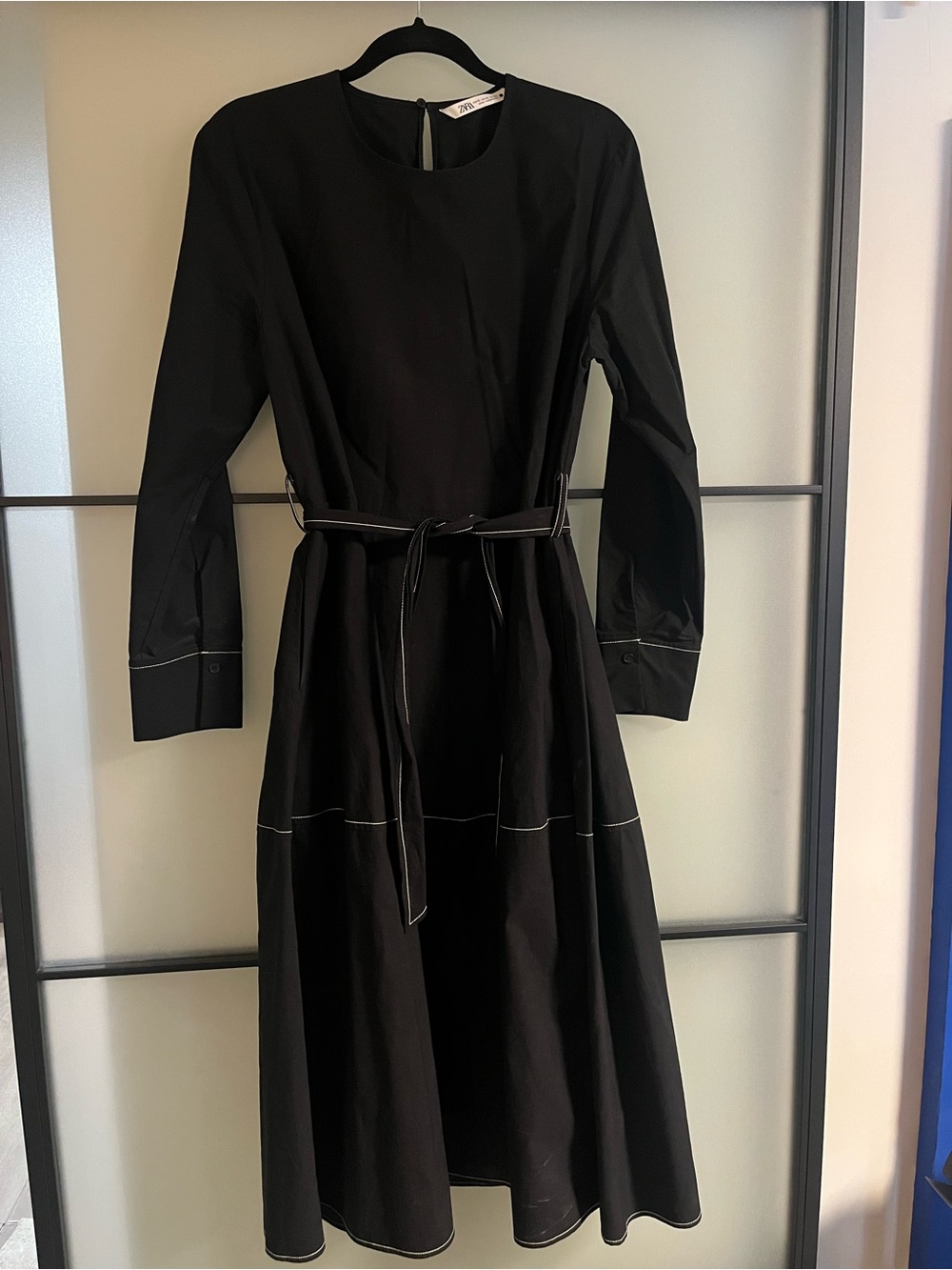 Zara Black Long-Sleeve Midi Dress with Tie Waist and white stitch detailing.